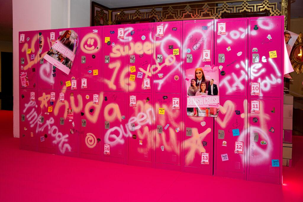 An activation in Huda Beauty event. Pink lockers with gifts inside.