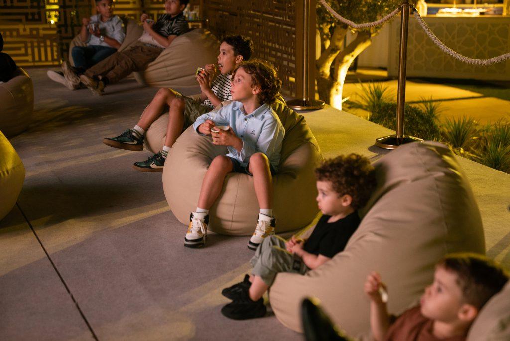 Kids watching at Cinema setup by Nspyr in ELC Iftar Dinner